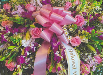 Purple & Pink Flowers & Pink Ribbon Bow Wreath